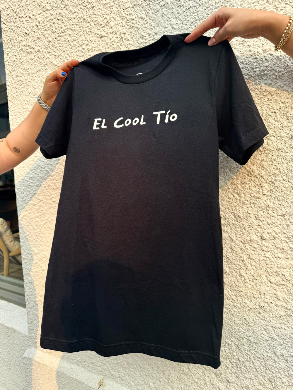 A black T-Shirt with white text on it