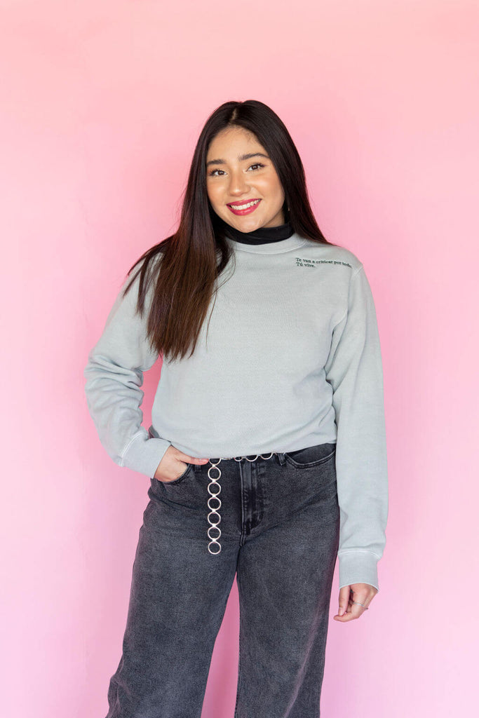 Teal sweatshirt with embroidered phrase