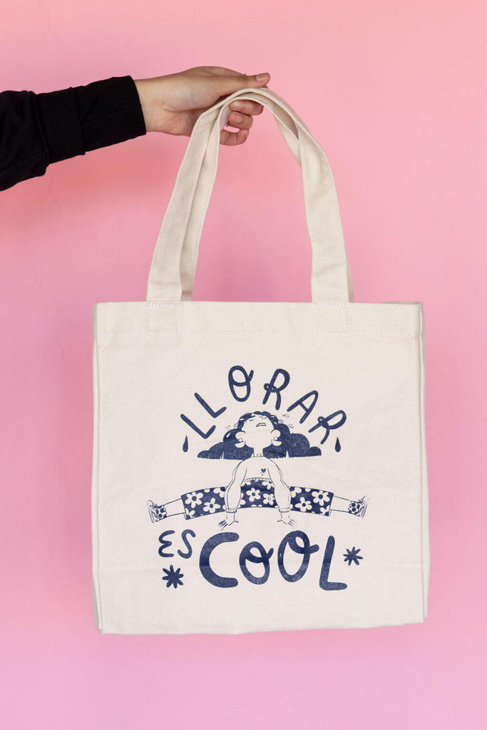 Navy "Llorar es cool" design printed on tote bag